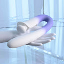 Spring Loaded Rechargeable Silicone Dual Vibrator Purple displayed on a hand with sleek design and vibrant coloring.