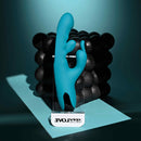 Bunny Tapper Tapping Rabbit Vibrator Blue displayed on a clear stand with textured background for enhanced visual appeal.