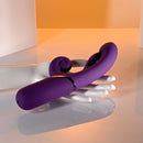 Pleasure Puff Silicone Expandable Rabbit Vibrator Purple on a hand, showcasing its elegant design and dual-vibration features.