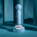 Iris Rechargeable Silicone Wand Blue displayed on a sleek pedestal against a blue backdrop.