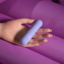Squishy Bullet Rechargeable Silicone Vibrator Purple held in a hand, showcasing its unique soft design and vibrant color.