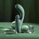 Spiral Charm Rechargeable Clitoral Stimulator Green with a unique spiraling ball design on a smooth surface.