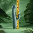 Satin Swirl Rabbit Vibrator with Clitoral Stimulator Green next to a measuring tape for size reference.