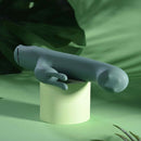 Satin Swirl Rabbit Vibrator with Clitoral Stimulator Green displayed against a green background.