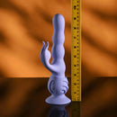 Wiggly Bunny Rechargeable Rabbit Vibrator Purple displayed next to a ruler for size reference on a reflective surface.