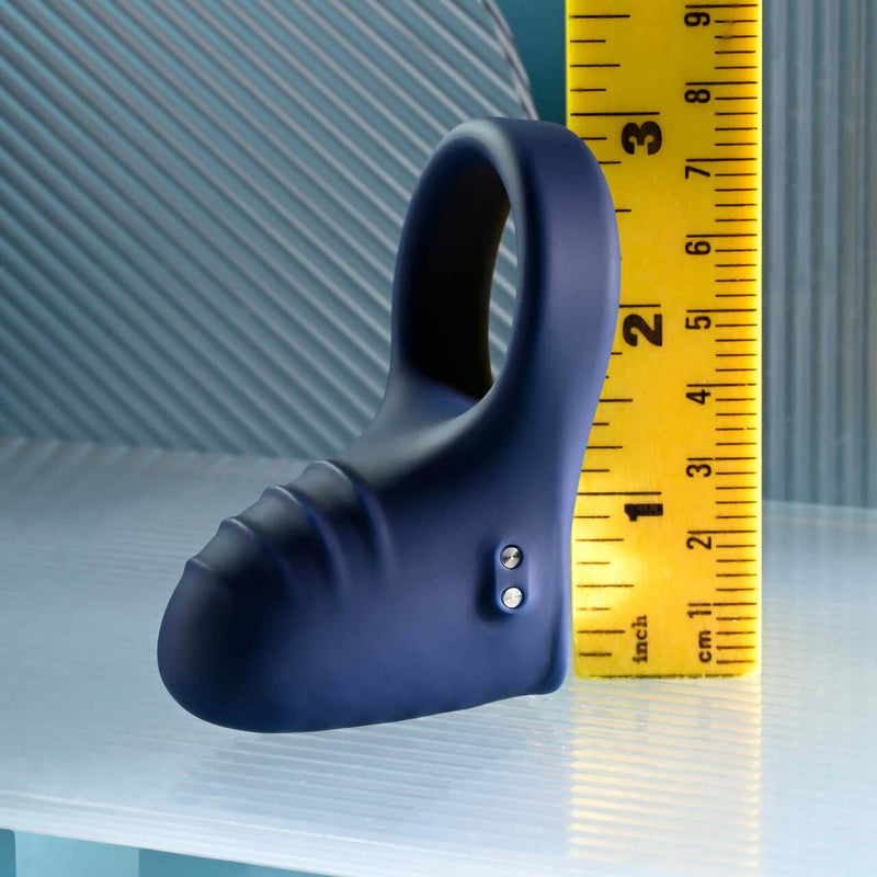 Playboy Pleasure Point Vibrating Penis Ring, displaying 10 speeds, made from body-safe silicone, shown next to a ruler for scale.