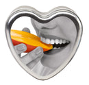Earthly Body Edible Heart Massage Candle Mango 4 Oz with mango slice and smiling woman holding candle.