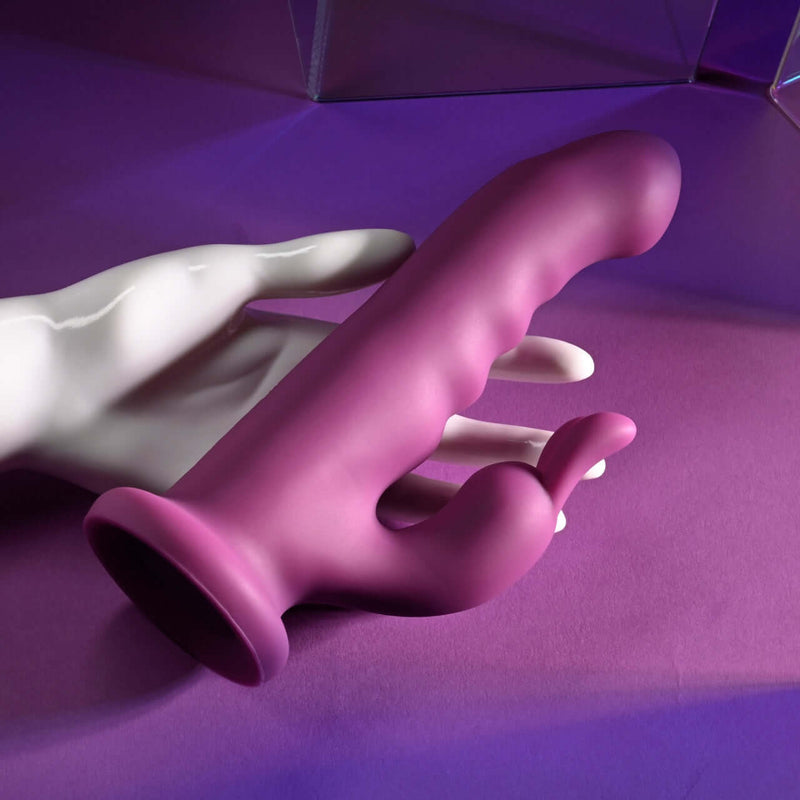 PLAYBOY Fluffle Rabbit Vibrator with Twirling and Vibrating Features in Purple Color on Display