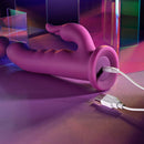 PLAYBOY Fluffle Rabbit Vibrator with USB charging cable in pink.
