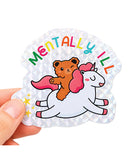 Mentally Ill Shiny Glitter Sticker featuring a teddy bear on a unicorn with colorful text and sparkly finish.