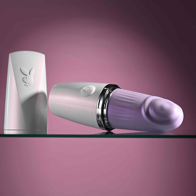 Playboy Getaway Tapping Toy in Lipstick Design with Cap Off, Displaying Tapered Shaft and Iconic Bunny Logo