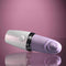 Playboy Getaway Tapping Toy - Lipstick Design, 7 speeds, waterproof, USB rechargeable – discreet purple pleasure device on reflective surface.