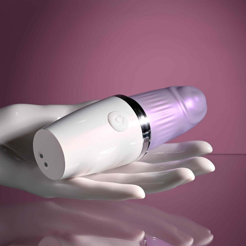 Playboy Getaway Tapping Toy in Lipstick Design | 7 Speeds, Waterproof, USB Rechargeable Displayed on Hand against Pink Background
