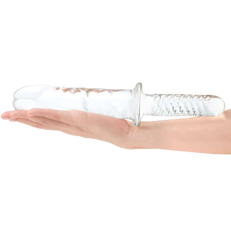 Person holding Gläs 11 Inch Girthy Cock Double Ended Dildo with Handle, featuring textured glass shaft and ergonomic grip