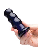 Glas 3.5 Inch Rechargeable Vibrating Beaded Butt Plug Blue held in hand for tactile exploration.