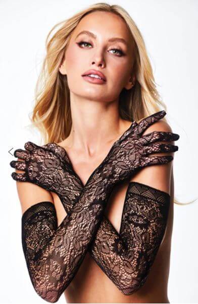 Elegant woman wearing black allover lace opera gloves with a glamorous pose.
