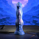 Gender X Wildest Dreams Vibrating Dildo with Remote Control on a textured surface against a cosmic backdrop.
