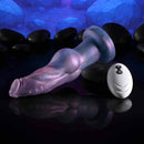 Gender X Imaginary Friend Vibrating Dildo with Remote Control on a dark surface with smooth stones.