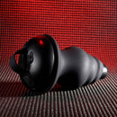 Gender X Echo Vibrator with textured silicone sleeve on red background, showcasing its unique design and vibration settings.