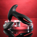 Gender X Spread The Love Vibrating Anal Plug with Remote Control Black on display with a sleek remote.