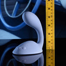 Gender X Shifting Gears Rechargeable Grind Pad Vibrator Blue on a reflective surface with a ruler for size reference.