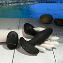 Gender X Team Work - Dual Vibrating Remote-Control Toys with 10 Speeds and Rotating Beads, placed on a display hand in serene lakeside setting.