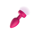 Viben Twila Twirling Light Up Vibrating Anal Plug Pink showcasing its vibrant color and illuminated features.
