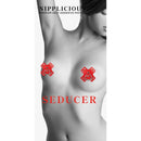 Nipplicious Seducer Leather Pasties with Rings Red displayed on bare skin, showcasing their sexy design.