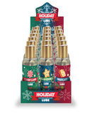 Holiday-themed water-based lubricants display with festive flavors: Candy Cane, Sugar Cookie, and Fruit Cake, 18 bottles, 2oz each.