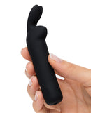 Happy Rabbit Rechargeable Bullet Black held in hand, showcasing its compact design for clitoral stimulation.