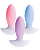Paradise Illumination THE Plug Vibrator in pink, purple, and blue showcasing elegant design and innovative pleasure features.