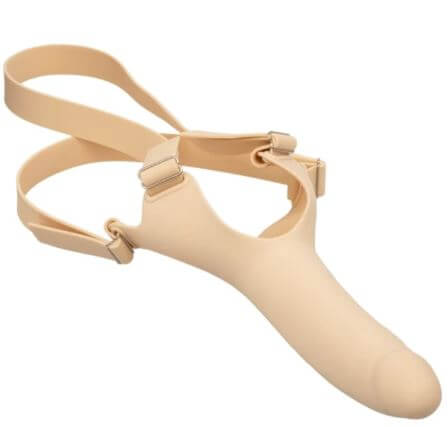 Accommodator silicone dong in ivory with adjustable head straps for hands-free dual stimulation and secure fit.