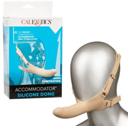 "Accommodator Silicone Dong in Ivory with head straps for hands-free stimulation, shown with packaging"
