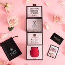 Alchemy Rosebud Luxury Air-Pulse Massager Red in elegant packaging with roses, designed for exquisite touch-free stimulation.
