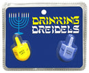 Drinking Dreidels Adult Game packaging featuring yellow and blue dreidels with game instructions.