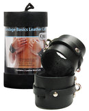 KinkLab Leather Wrist Cuffs Black displayed with packaging, showcasing sleek black leather design for restraint play.