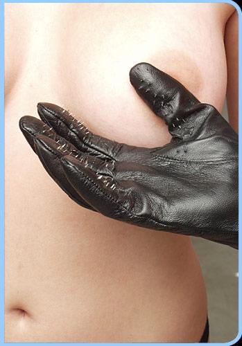 Kink Lab Vampire Gloves Leather with Metal Points Medium in use for sensory play.