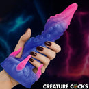 Creature Cocks Krakenar Tentacle Silicone Dildo held in hand, featuring vibrant colors and intricate tentacle design.