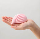 Tenga Iroha Plus Kushi Nadeshiko Massager held in a hand, showcasing its soft-touch design and elegant pink finish.
