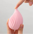 Tenga Iroha Plus Kushi Nadeshiko Massager close-up showing the ribbed texture and soft-touch design in elegant pink.