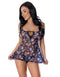 Woman wearing Hazy Dayz Dress & G-String Set with rainbow mushroom design, black light reactive, seductive style.