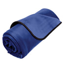 Liberator Fascinator Moisture Barrier Throw Indigo rolled up showing luxurious plush microfiber surface.