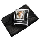 Liberator Fascinator Fur Throw Queen Black laid out alongside its packaging on a plush surface.