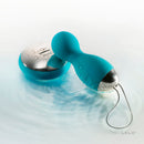 Lelo Hula Beads Rotating Remote Vibrator Ocean Blue in a serene setting with droplets of water.