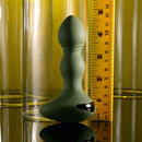 Evolved Lieutenant Vibrating Plug with egg-shaped base and textured shaft next to a ruler for size comparison