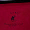 UPKO logo and quote on a pink surface, featuring playful imagery and a whimsical message about passion and turmoil.