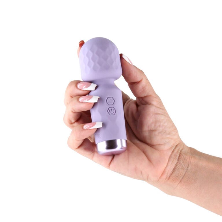 Lust N Dreams Salsa Petite Body Wand Lavender held in hand, showcasing its compact design and easy-to-use controls.