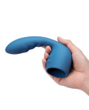 Le Wand Petite Flexi Silicone Attachment Blue held in hand showcasing its flexible design and targeted stimulation features.