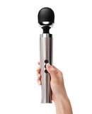 Le Wand Die Cast Rechargeable Massager Silver held in hand, showcasing sleek design and powerful features.