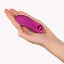 Fun Factory Bijou Bullet Vibrator Magenta held in a hand, showcasing its sleek design and vibrant color.